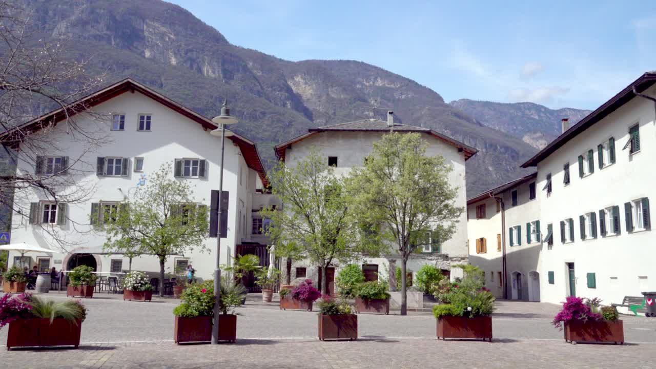 Quiet main square in the town centre of Kurtinig - Cortina, South Tyrol, Italy on a sunny day