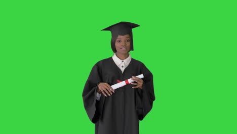 african american female graduate holding diploma and giving speech on a green screen, chroma key