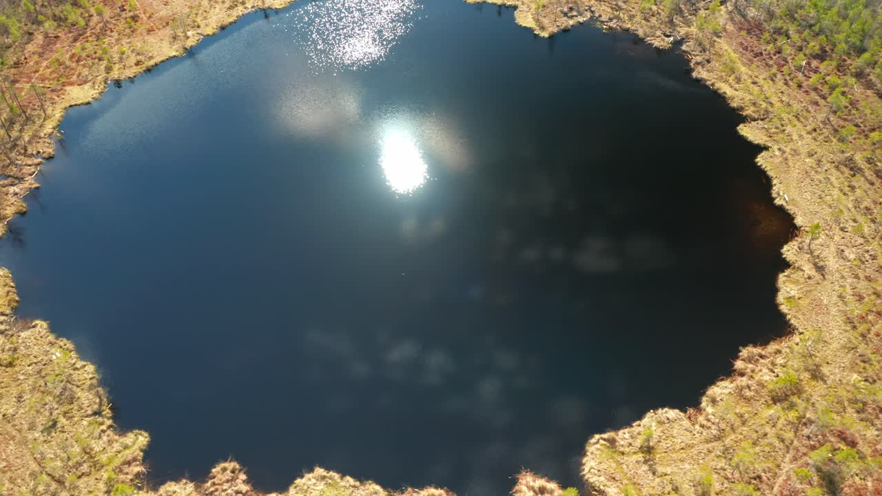 AERIAL: Reflections of Sun Playing on the Surface of Lake in Lithuania
