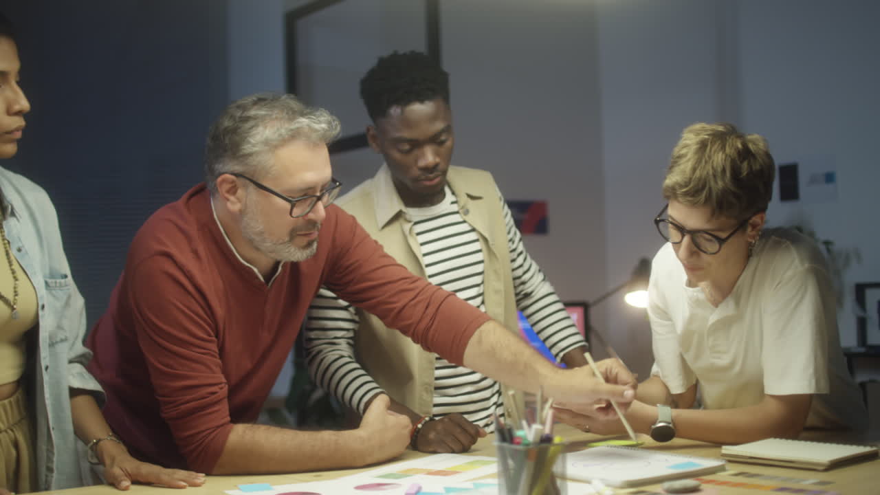 Creative Team Brainstorming in Office at Night