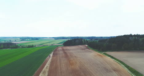 Aerial-Of-Combine-Harvesting-Wheat-Field