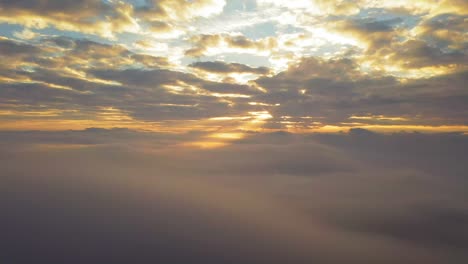 sunset panorama view above massive clouds and fog, aerial shot