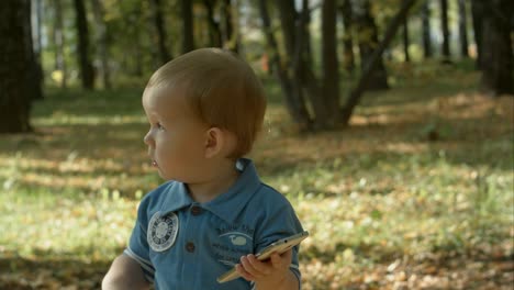 adorable baby stops calling with cell phone