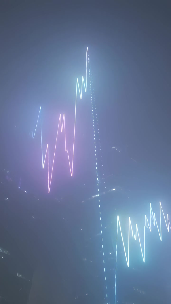 Video verticale: Arte al neon pulsante che illumina lo skyline notturno della città con un raggio punteggiato e zigzag rosa-ciano.