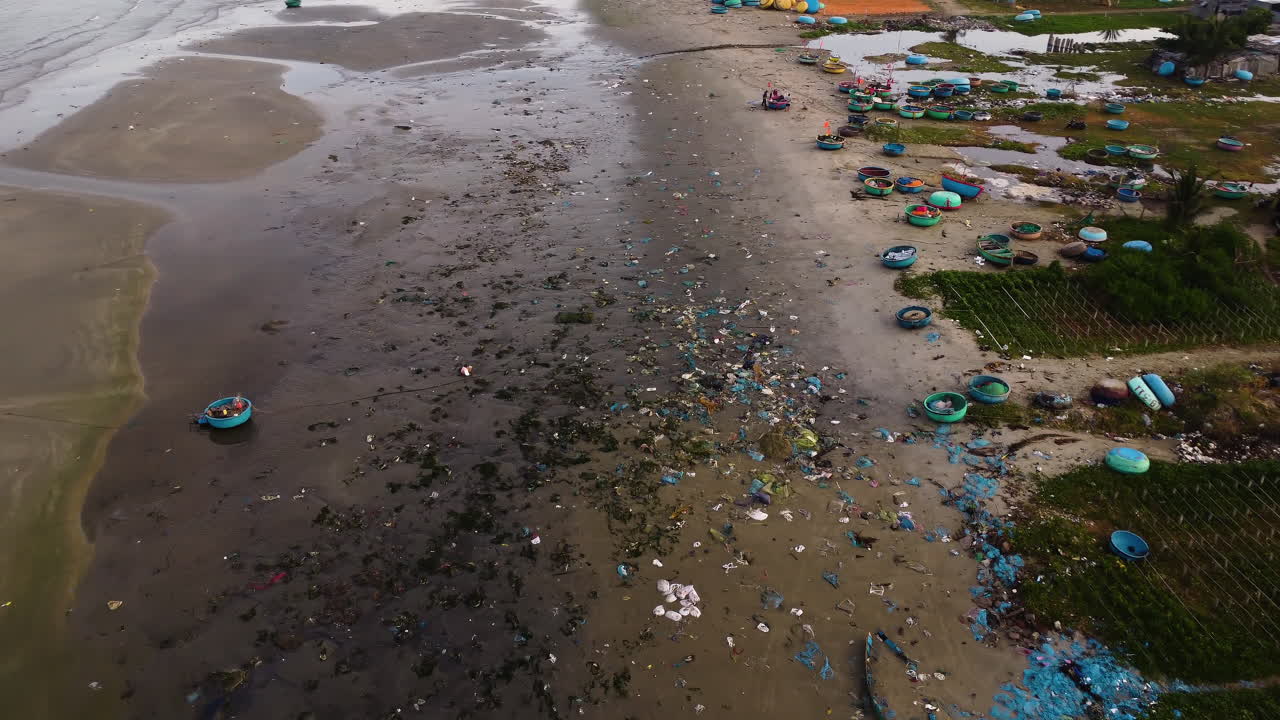 Aerial flying forward over insanely polluted beach in Vietnam