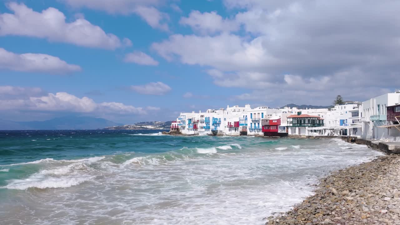 Static video of Little Venice in Mykonos, Greece, on a bright sunny day, showing iconic seaside houses, blue sea, and Cycladic charm