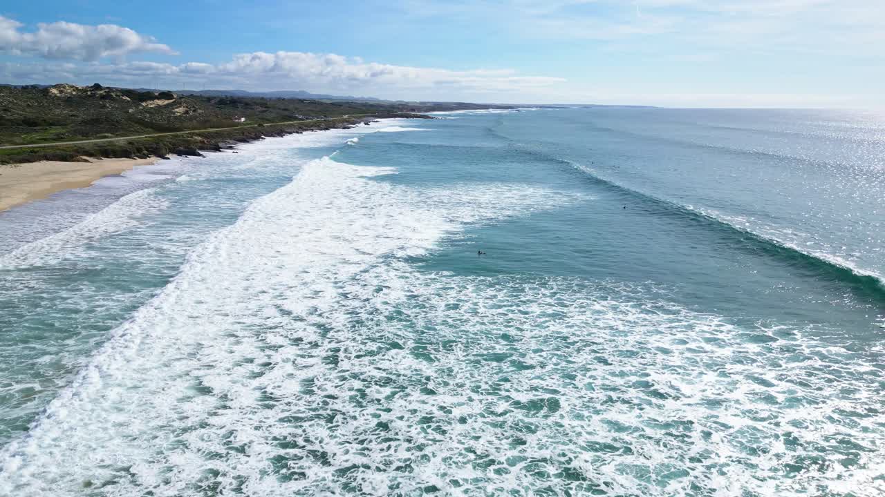 Ocean waves crash on a scenic coast in Portugal's Alentejo, peaceful and wide view