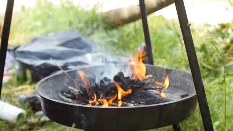 preparing charcoal for meat for summer picnic