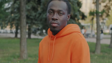 man in orange hoodie