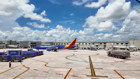 southwest airlines airplane departing from miami international airport in terminal 1 - panning