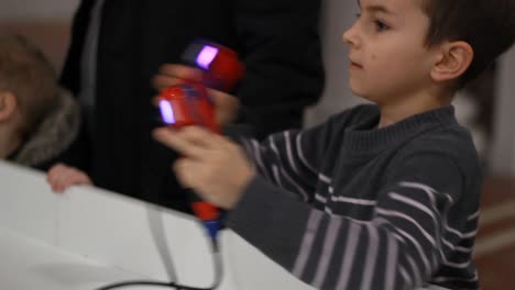 Boy-boxing-with-gamepad-in-hands.-Kid-remote-controlling-robot