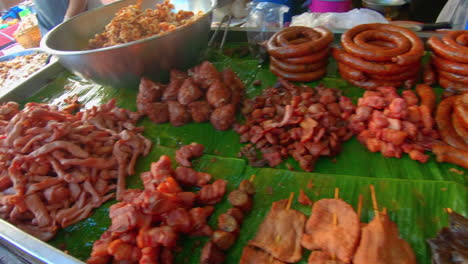 slow motion | street market food being prepared in thailand