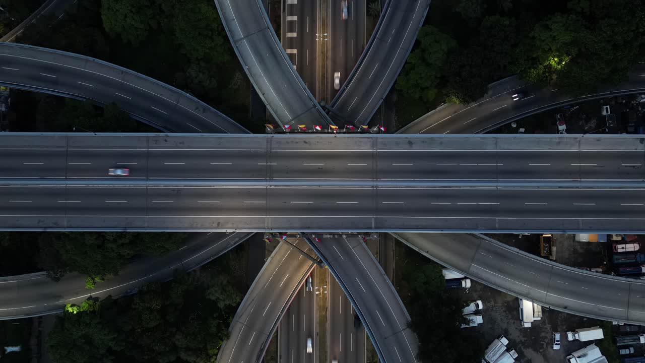 A Drone aerial shot of a highway in Caracas, Venezuela, with cars passing by at high speed.