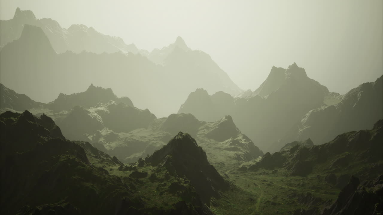 Mountain landscape with misty peaks and lush valleys at dawn