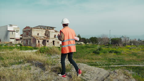 engineer walking on an high spot to watch the construction site from above