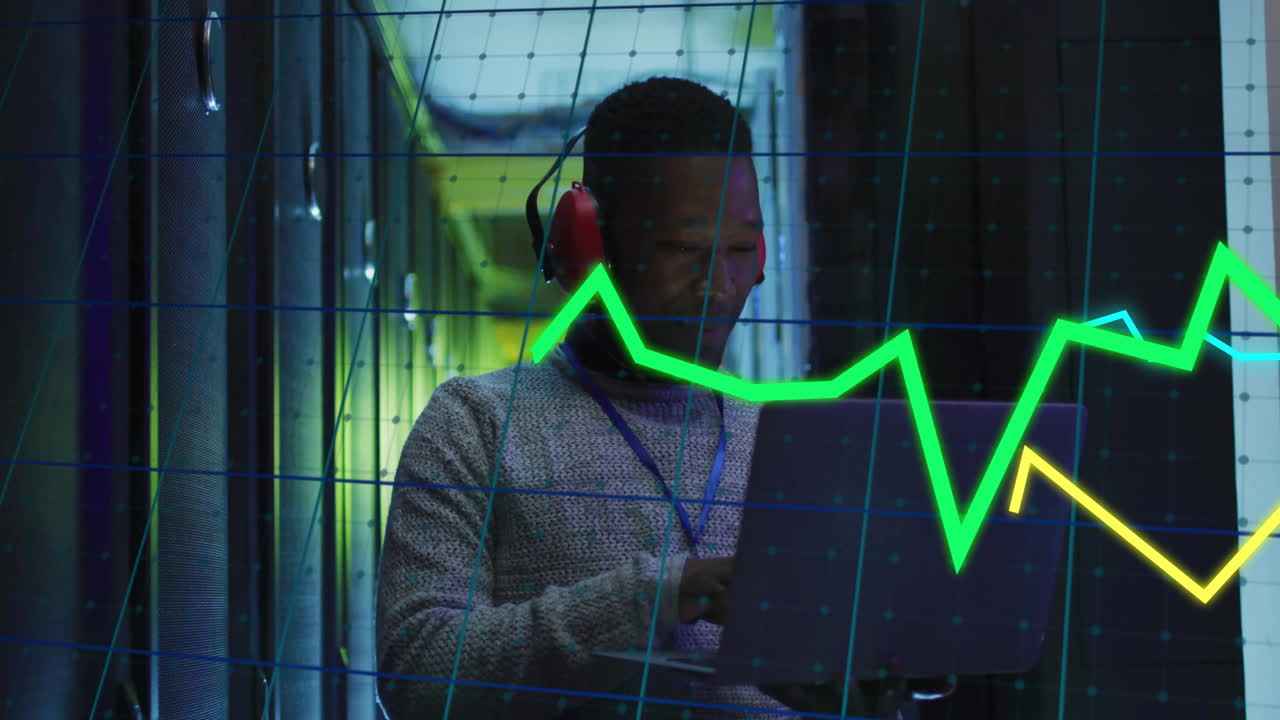 Animation of financial data processing over african american businessman in server room