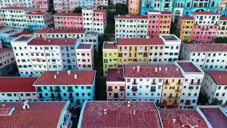 drone shot of sunset town, a fake italian city with buildings during the day in phu quoc island, vietnam