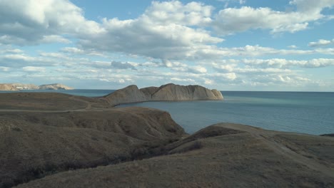 coastal landscape with hills and sea