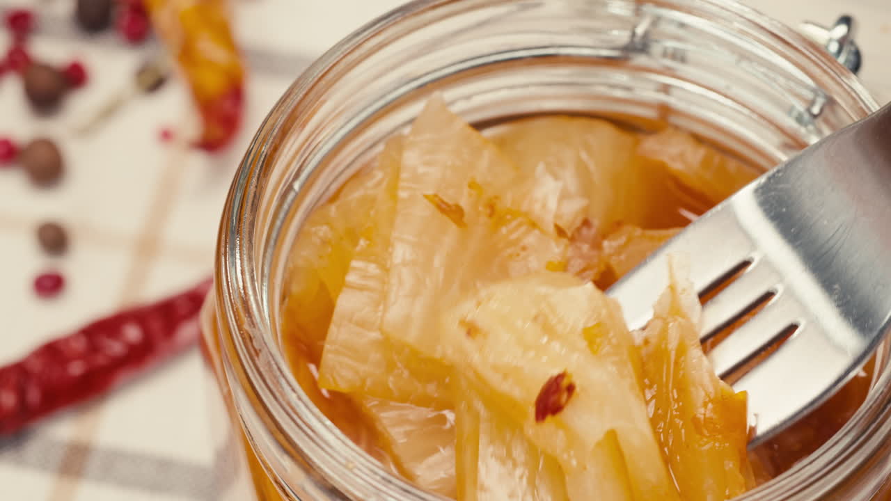 Close-up of fermented spicy cabbage kimchi with in can. Preservation of vegetables in glass jars. Fermentation preserved kimchi cabbage with spices macro. Asian cuisine.