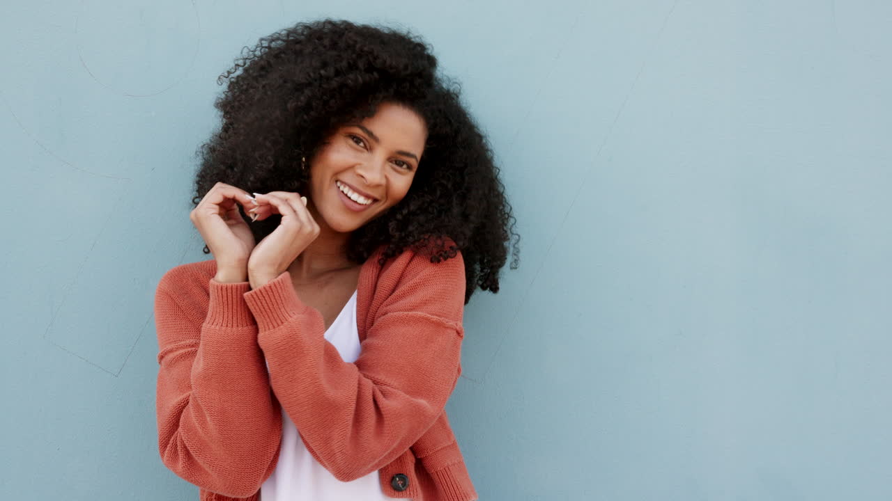 Smile, love sign and happy black woman portrait