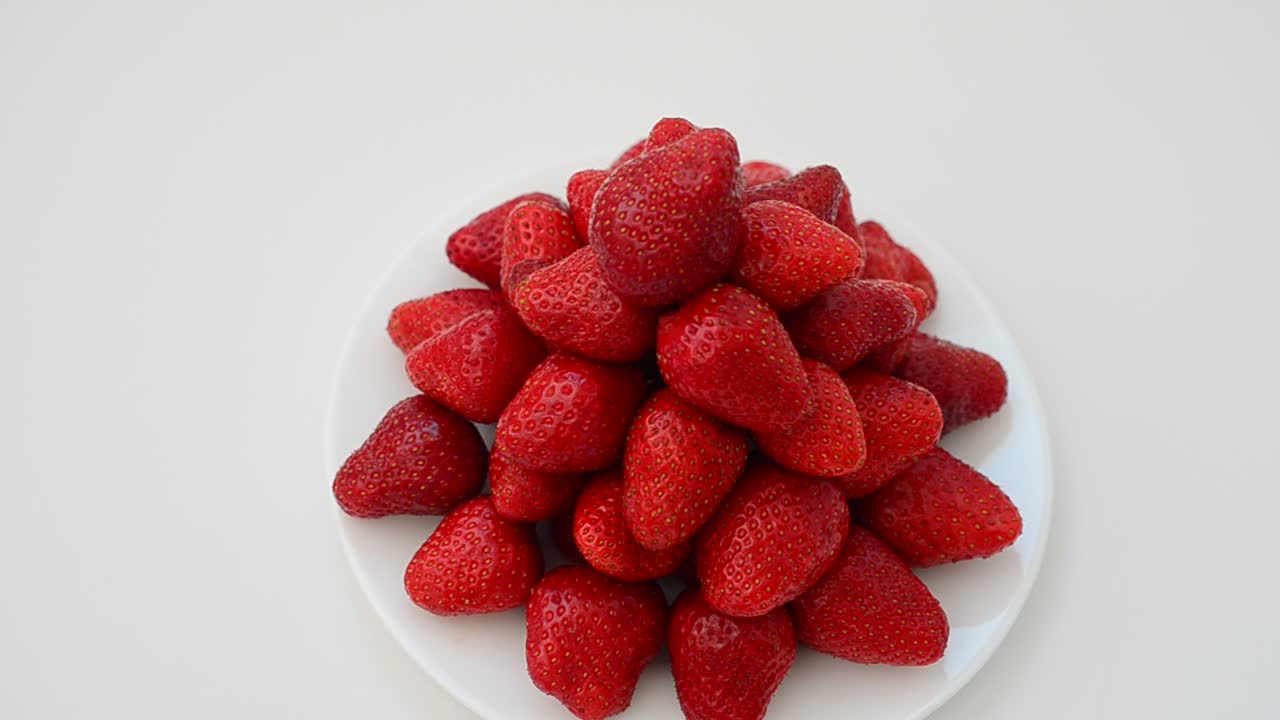 Strawberry on a white background, isolate. Shooting in the movement