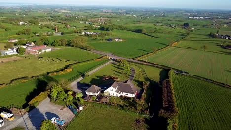 lowering drone shot of farmland in ireland