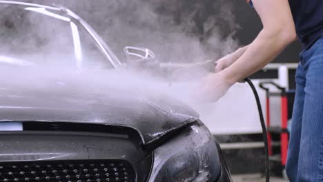 man covering car with vinyl polyurethane tape. films for the car. sticker protective film on the car