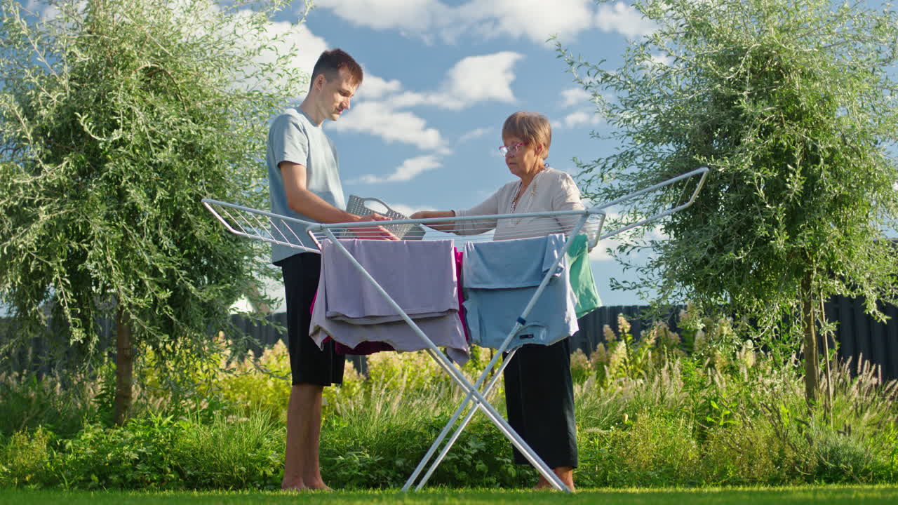 Family Drying Clothes in the Backyard