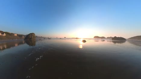 wide-angle pan over bandon beach at sunset in golden light