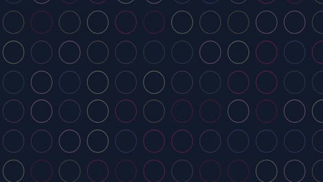 animación digital de múltiples formas circulares coloridas contra un fondo negro