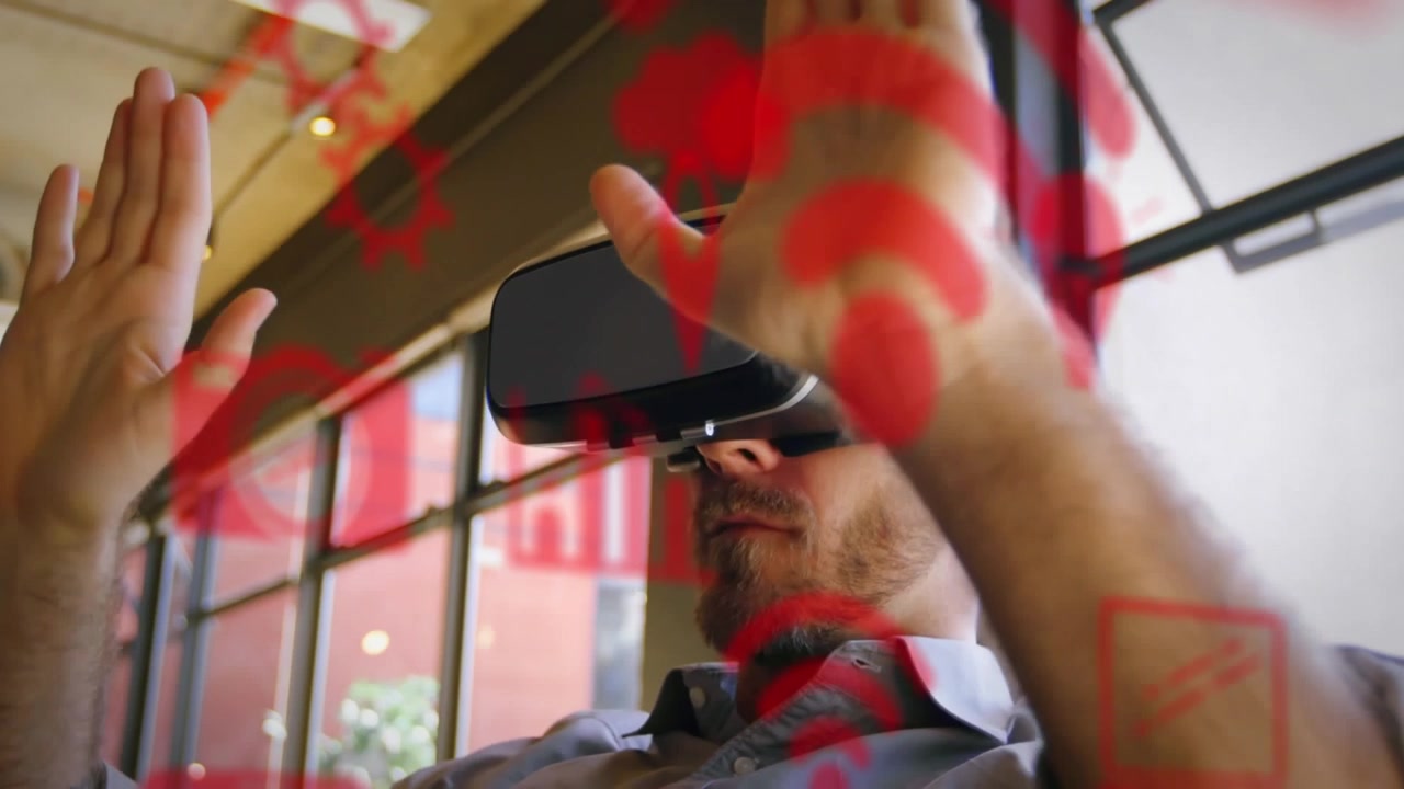 Man Using Virtual Reality Headset with Digital Interface Overlay