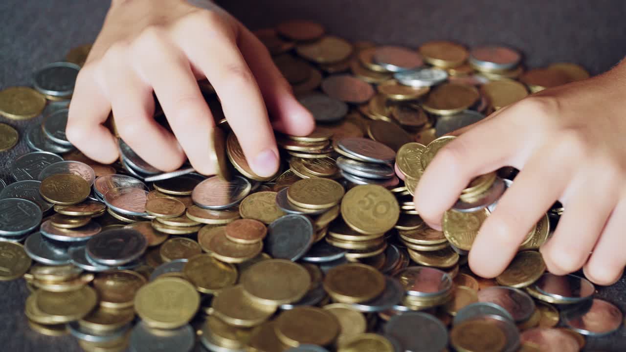 Coins in hands. Money concept.