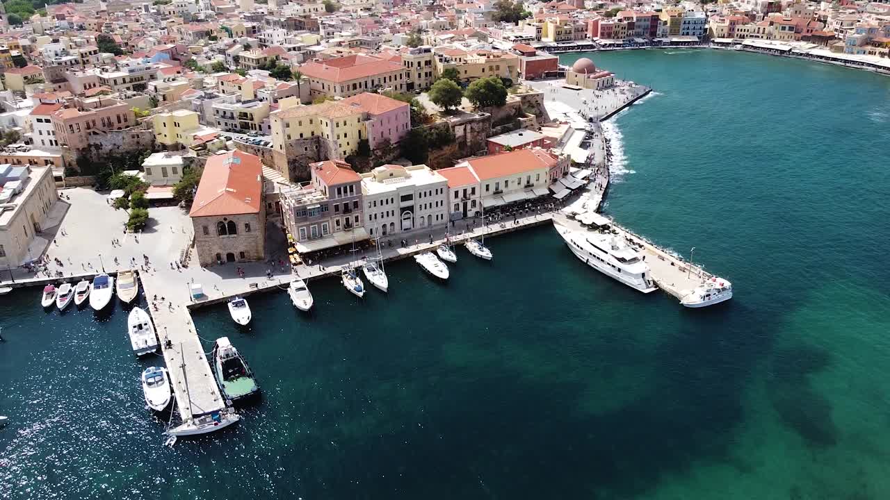 Iconic Greek building and pier of Chania city, aerial view