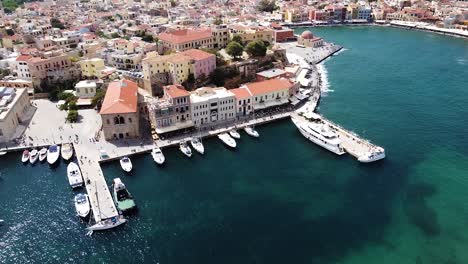 iconic greek building and pier of chania city, aerial view