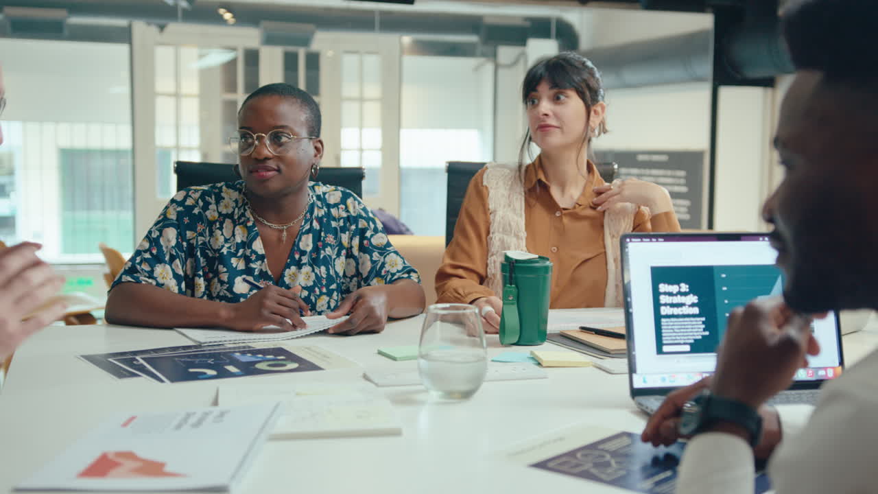 Male CEO Holding Business Meeting with Diverse Team in the Office