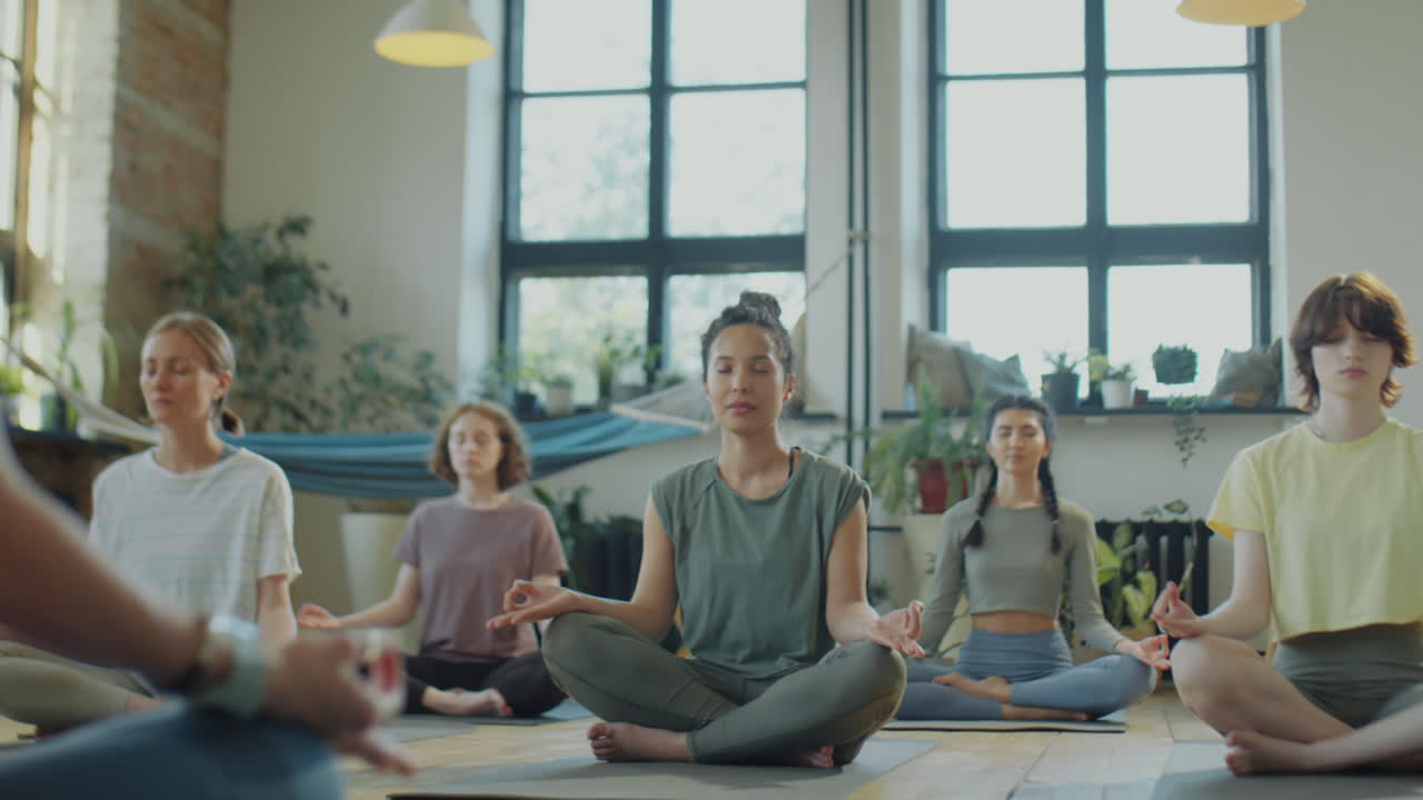Group of Women Practicing Yoga Meditation