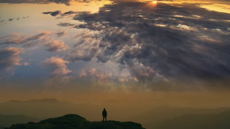 the male standing on a mountain with a cloud stream background. time lapse