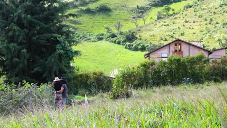 romantic couple embracing on windy mountain property