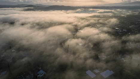 amazing fog with the sun rising over the mountains, stunning winter aerial view in the caribbean