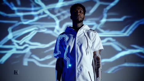 man with futuristic circuitry projection