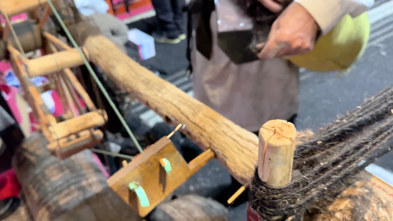 Traditional wooden spinning wheel tools spin Goat wool to make weaving fiber Handmade textile craft of Antique yurt cover Nomad art Iran Mongolia Village workshop retro skill handwork yarn material