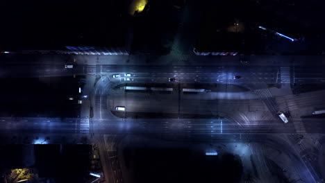 aerial night vertical view cars and street lights and illuminated streets in a modern city