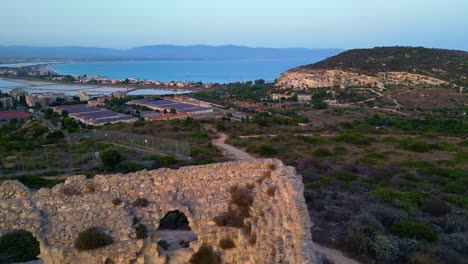 Cinematic-aerial-footage-departing-from-Fortino-di-Sant'Ignazio,-Cagliari