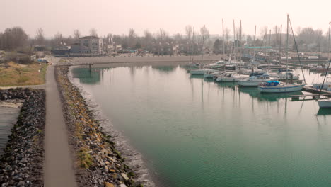 aerial: harbour and vacation park during hazy spring day