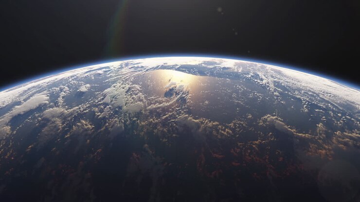 Amanhecer, o sol nasce atrás do planeta Terra. Nascer do sol sobre o globo