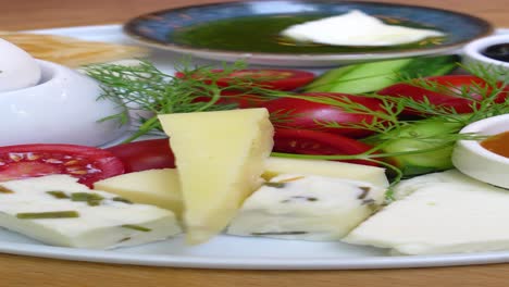 turkish breakfast platter with cheese, vegetables, and dips