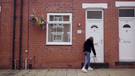 girl safely dropping off a care package to grandparent's house | wide shot