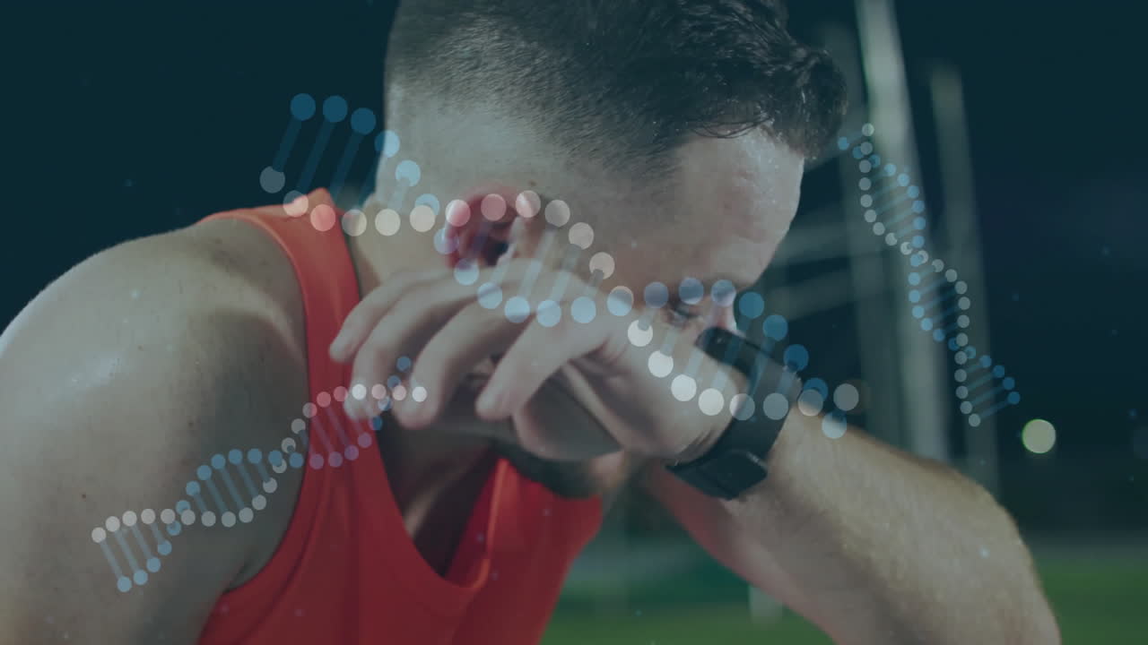 Male athlete wiping sweat on running track, featuring DNA helix animation and fitness smartwatch