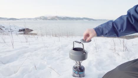 Making-Pine-Needle-Tea---Man-Open-The-Lid-Of-Kettle-With-Boiling-Water-Then-Put-Pine-Needles