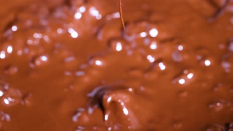 spoon stirring melting chocolate chips smoothly